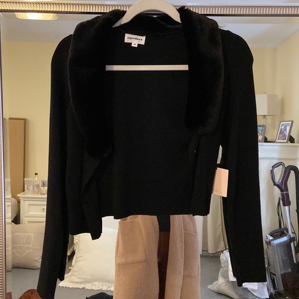 Cropped button up sweater. Super cute but never had opportunity to wear. tag on